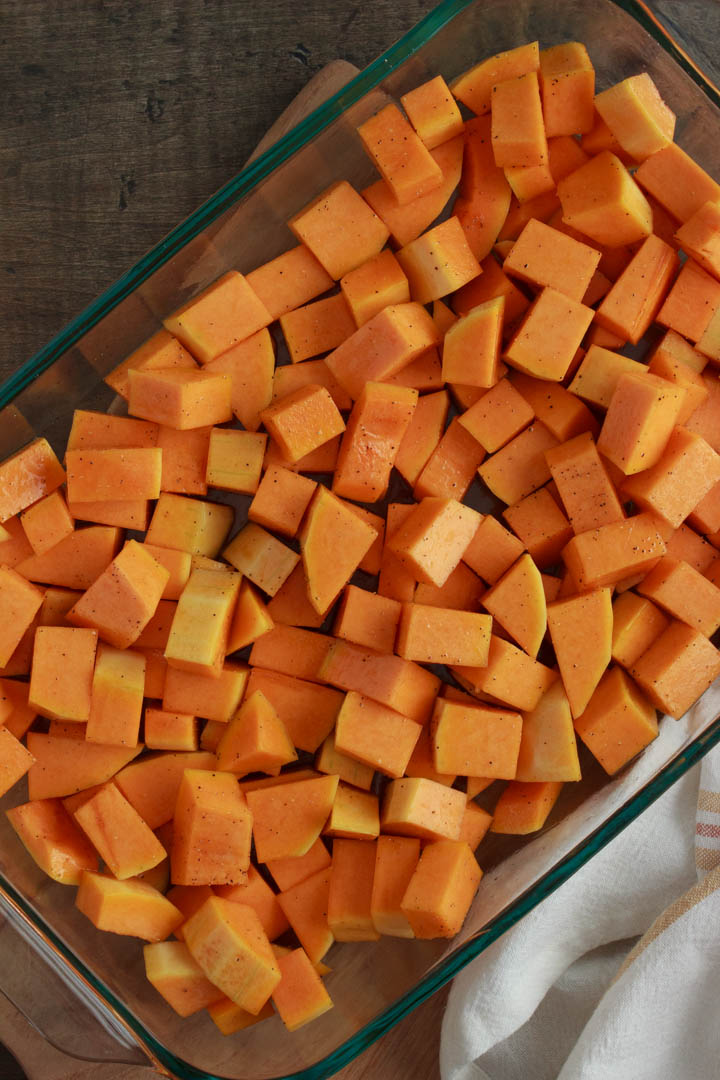 Butternut squash seasoned and ready to be roasted