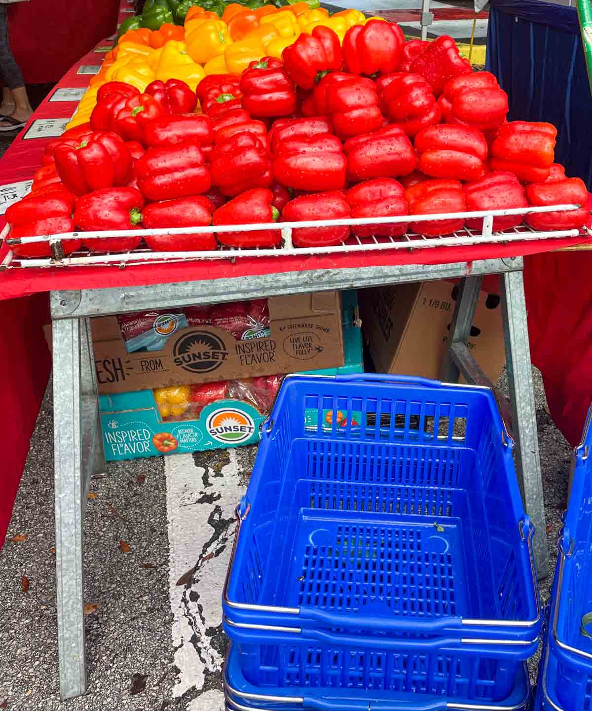 Example of a reseller at the farmers market with branded boxes under their table.