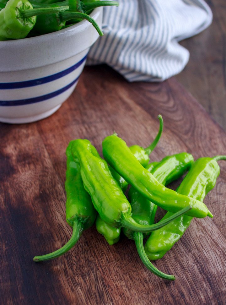 Shishito peppers, close up shot on a cutting board