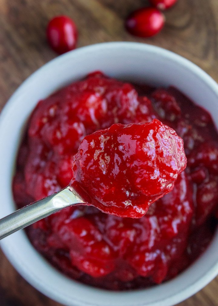 Spoonful of Homemade Organic Cranberry Sauce with less sugar than other cranberry sauce recipes
