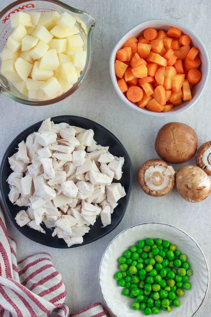 Gluten-Free Chicken Pot Pie (From Scratch) filling ingredients: potatoes, chicken, carrots, mushrooms, peas