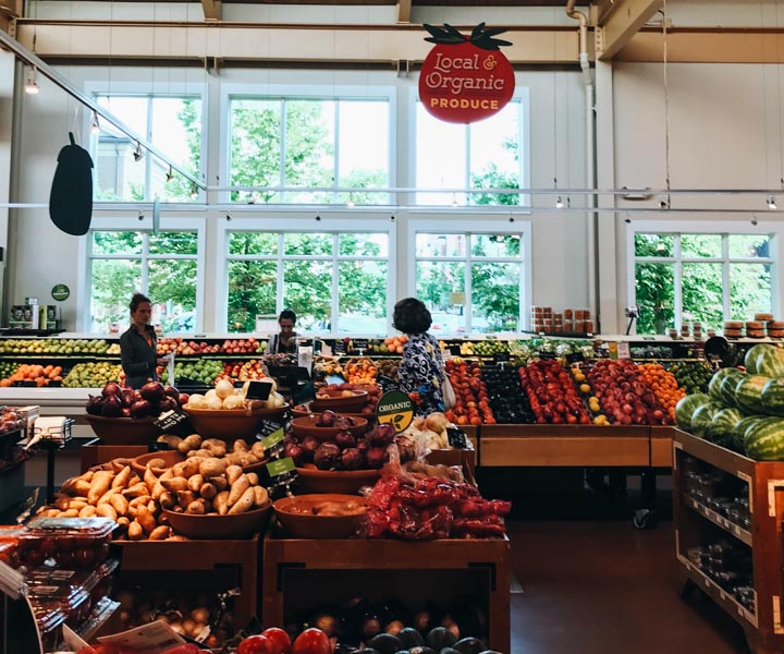 Produce section of an organic grocery store or food co-op.