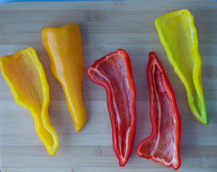 Sweet peppers sliced with seeds, veins and stems removed.