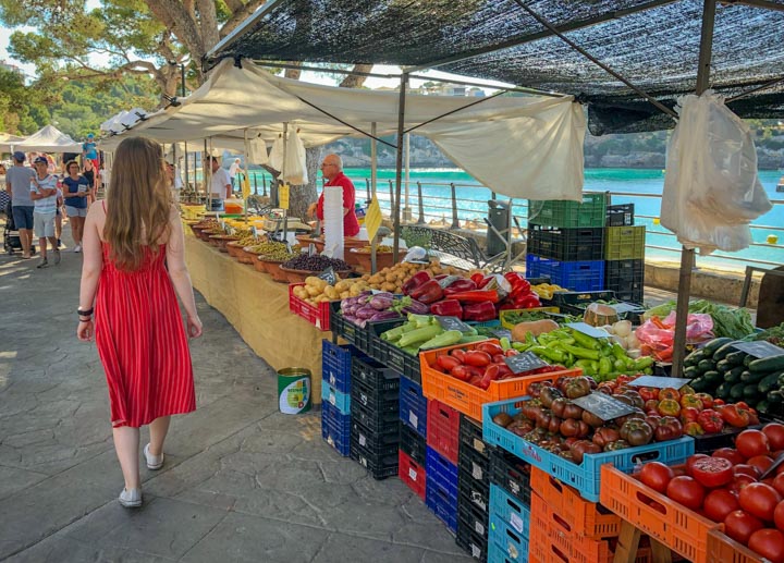 Young woman walking around a farmers market