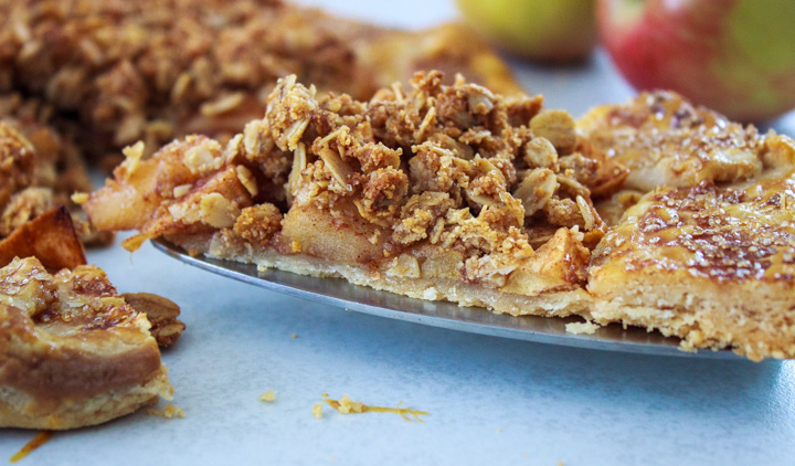 Closeup photo of a slice of apple galette with sweet crisp topping