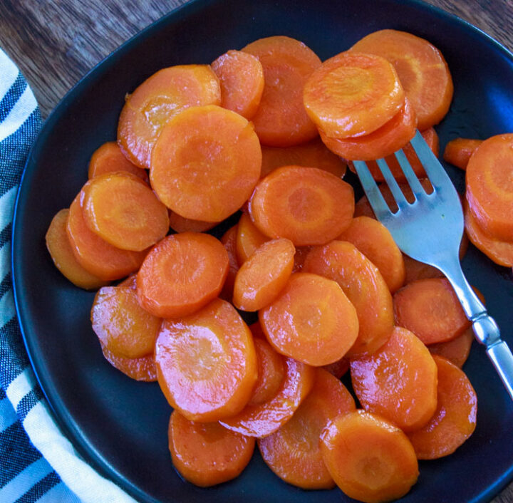 Maple glazed carrots on a plate with a fork