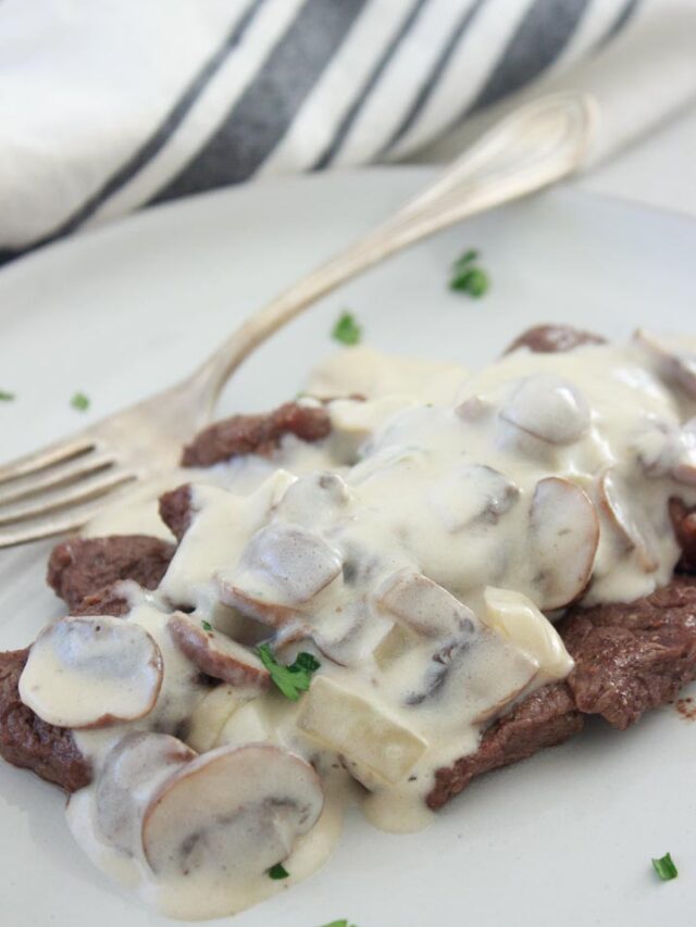 Creamy mushroom sauce on steak. Grass-fed flat iron steak.