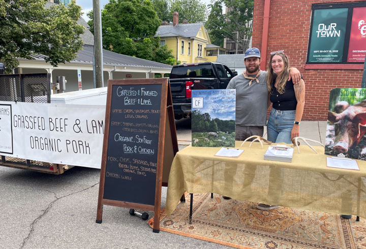 Jake and Luna of Crow Fly Farm at the Asheville City Market Selling their Grass Fed Beef