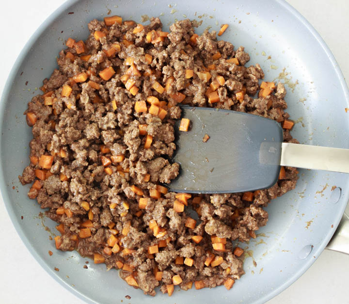 Carrots, onion and ground beef for shepherd's pie in the frying pan