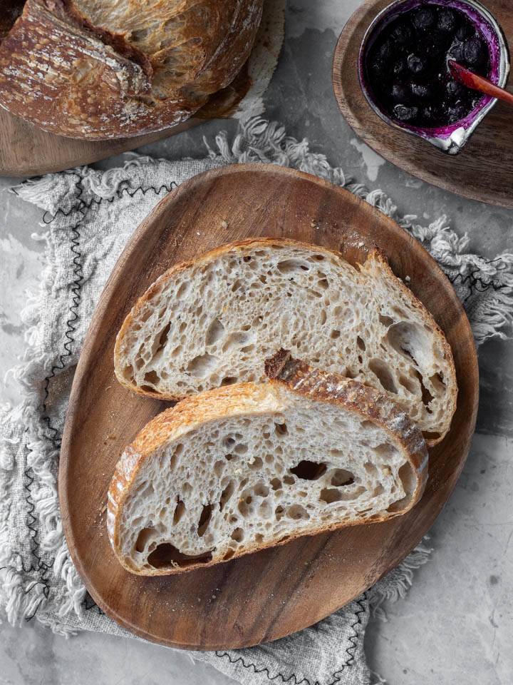 Slices of homemade bread and blueberry compote