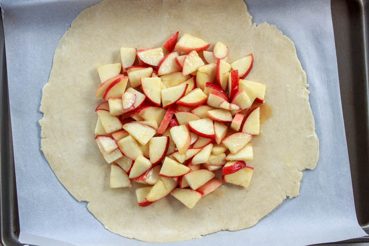 Galette dough topped with the peach slices and honey