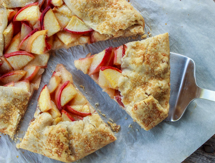 Taking a slice of peach galette