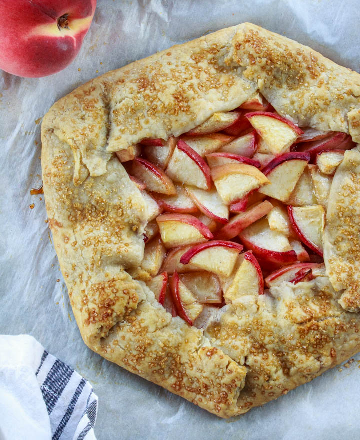 Gluten-free peach galette fresh from the oven before being cut