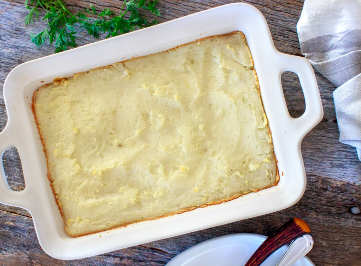 Shepherd's Pie with Ground Beef & Creamed Corn done in casserole dish, ready to slice into