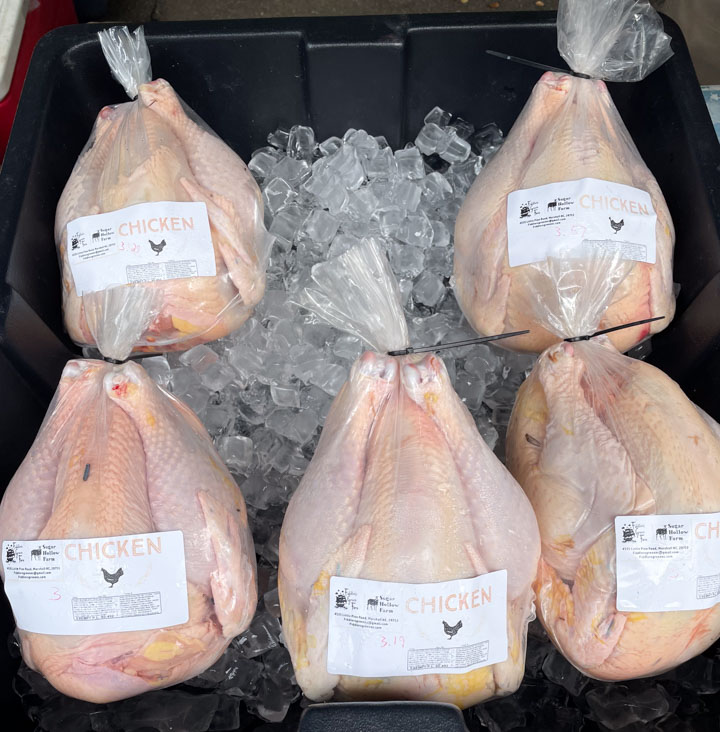 Whole chicken from a small farm being sold at the farmers market