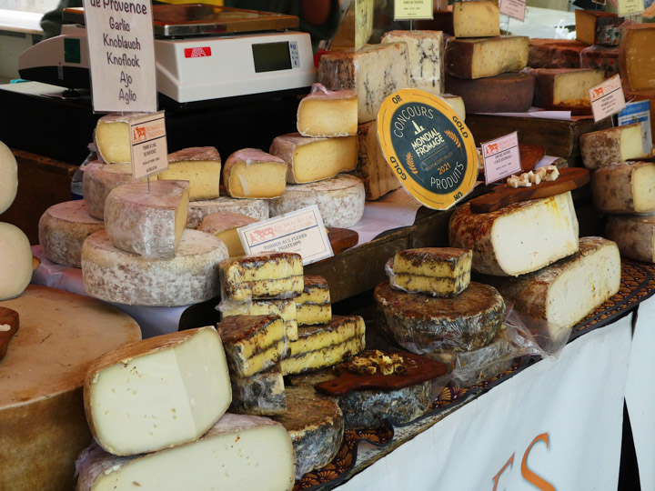 A variety of French cheese at the market.