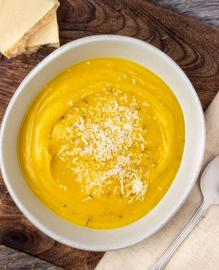 Bowl of Roasted Butternut Squash Soup with parmesan cheese.