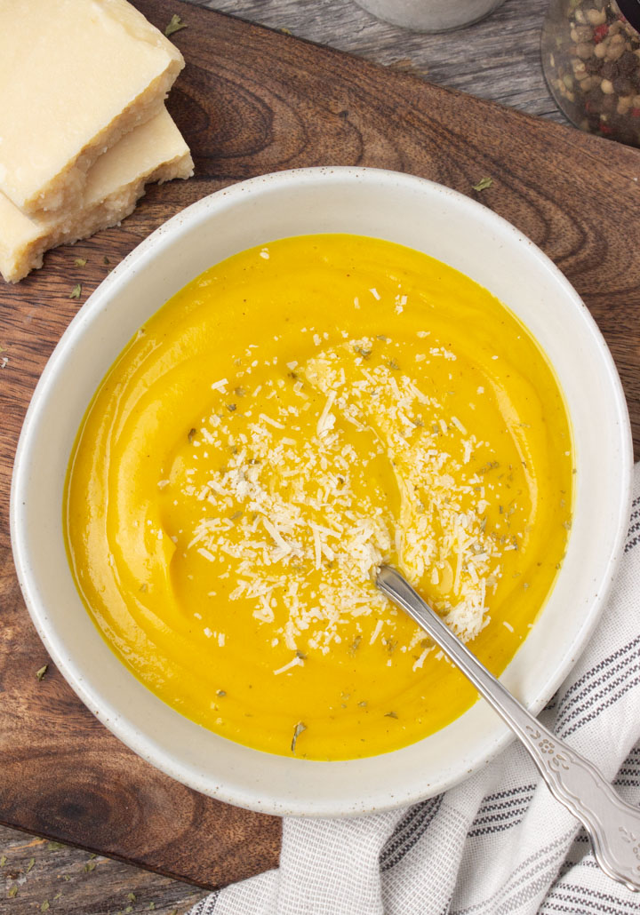 3-Ingredient Roasted Butternut Squash Soup Recipe - Bowl of butternut squash soup topped with parmesan cheese