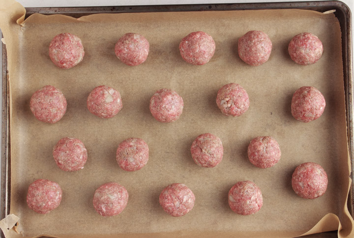 Grass-fed beef meatballs on a baking tray ready to bake