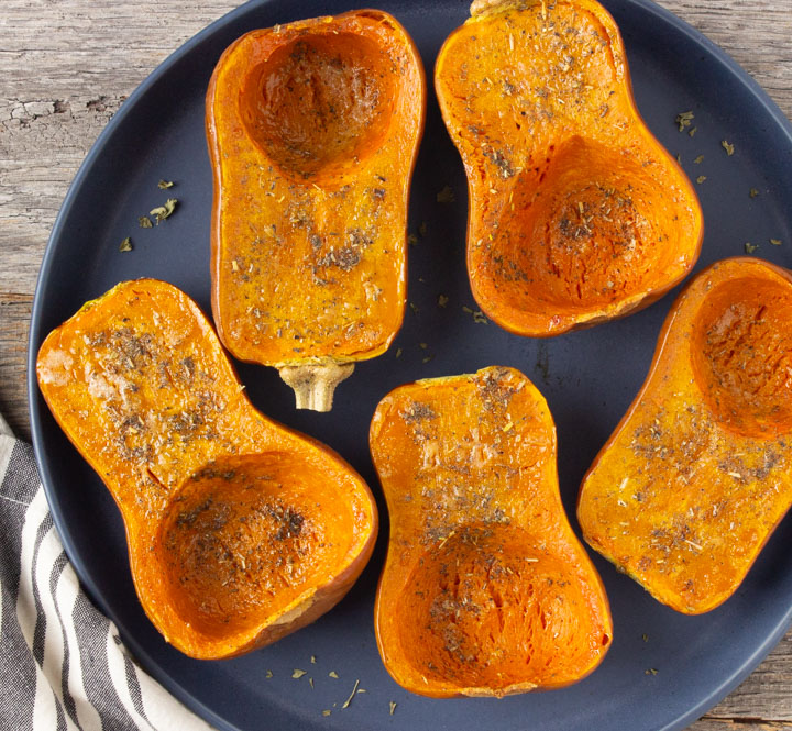 Plate of roasted honeynut squash fresh from the oven