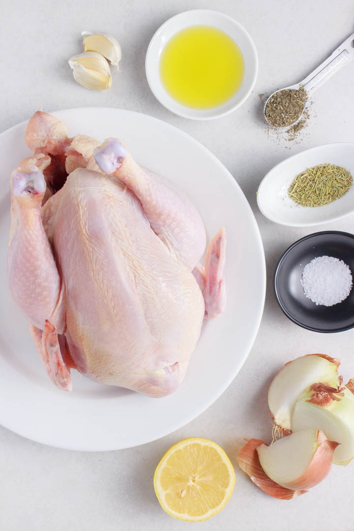 Slow Cooker Whole Chicken Ingredients: Pastured chicken, garlic, olive oil, sage, rosemary, salt, onion, lemon