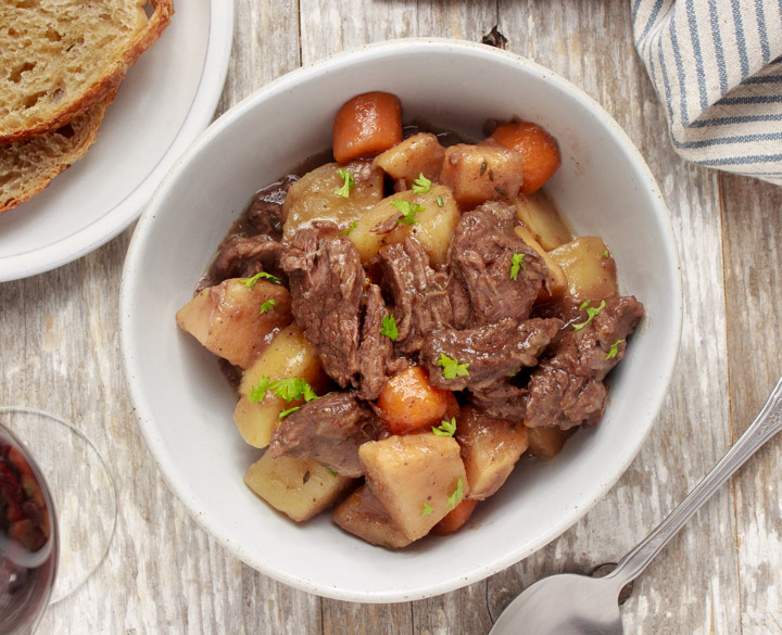 Bowl of beef stew made with red wine in the slow cooker