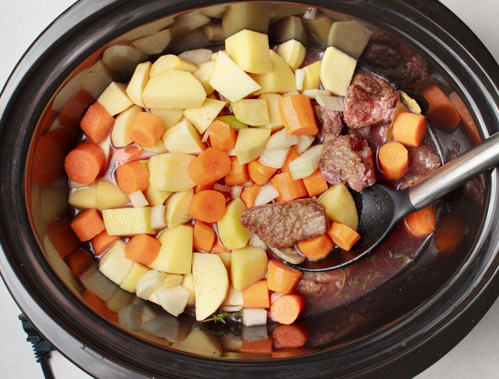 Beef stew with red wine broth - all ingredients in the slow cooker.