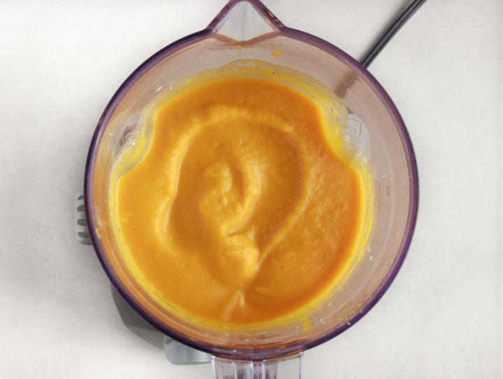 Pureed butternut squash soup in blender