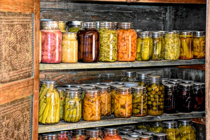 8 Ways to Eat Local During Winter - Pantry lined with canned veggies